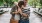 a couple walking through a park