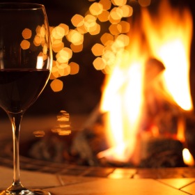 All the comforts of luxury living a glass of wine near a fire pit