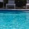 a pool with a chair in the background