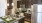 a kitchen with a bar and a refrigerator