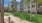 a building with trees and grass