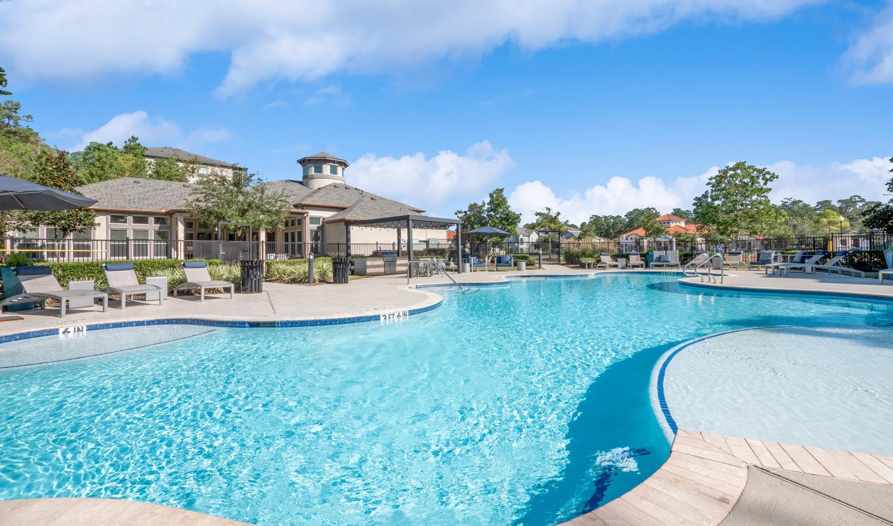 a pool with a building in the background